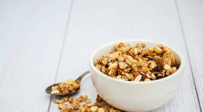 Bowl with granola on a old wooden table