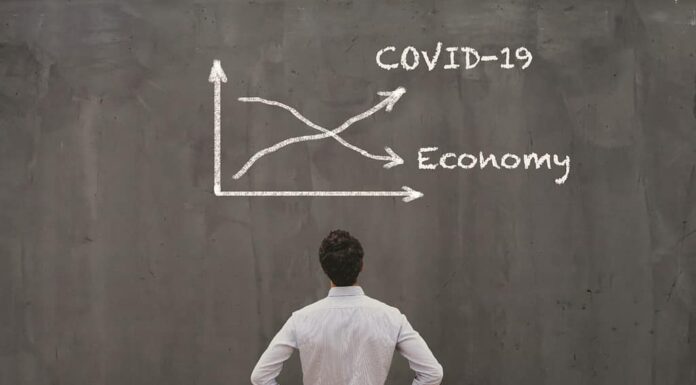 concetto di crisi economica dovuto al coronavirus COVID-19 diffuso nel mondo, curva del virus in aumento, economia in calo