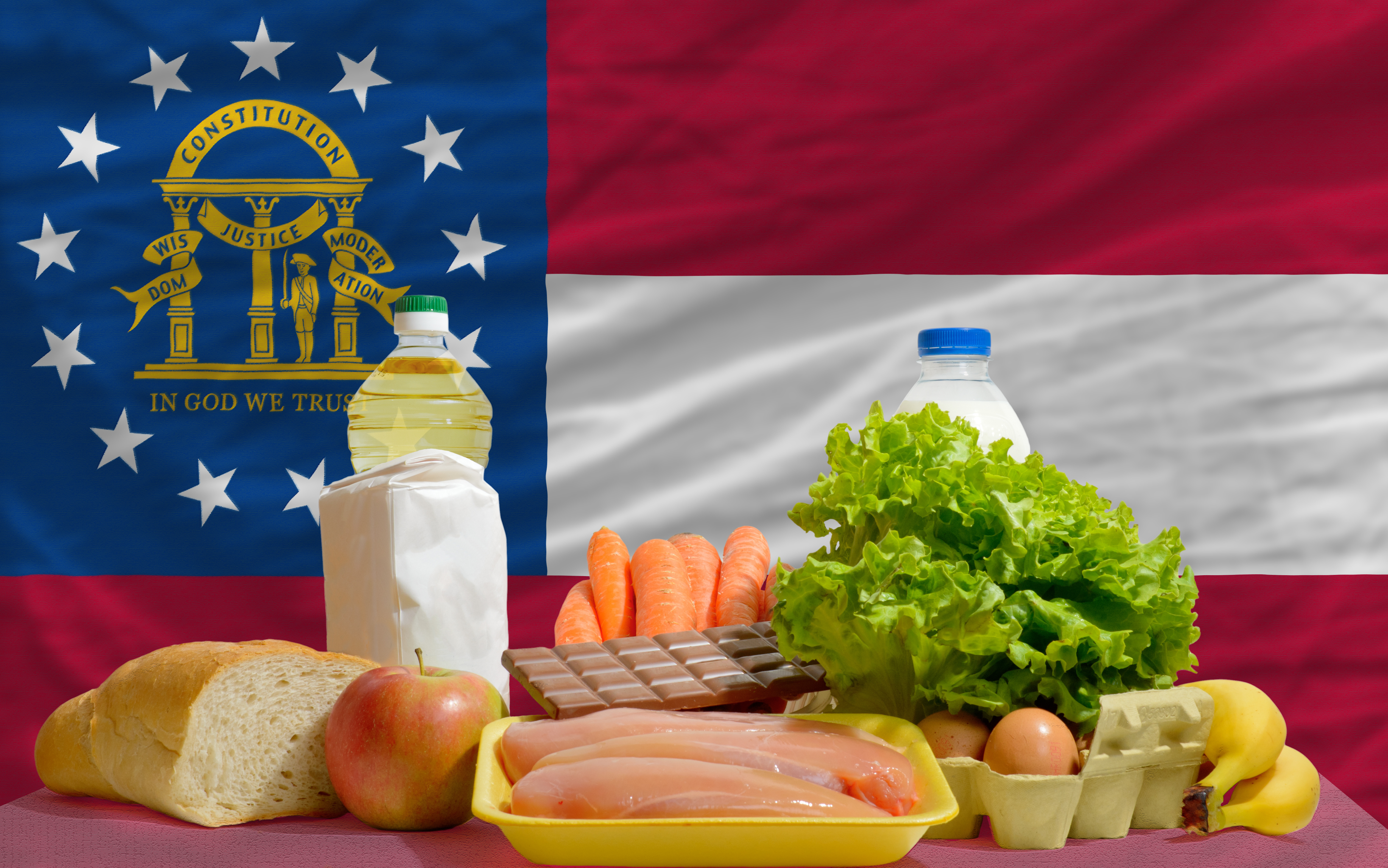 generi alimentari di base di fronte alla bandiera dello stato americano della Georgia