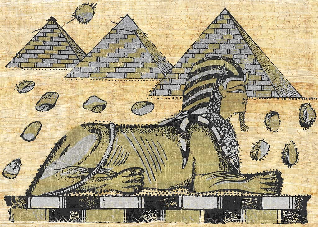 Un antico papiro egiziano che mostra una sfinge e piramidi