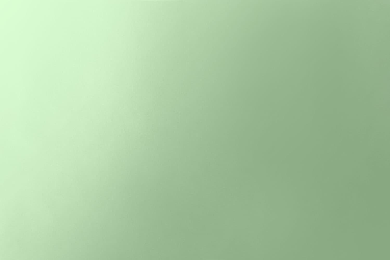 Vuoto pianura morbida gradazione di colore verde pallido su carta riciclabile texture minimalismo pacifico concetto di sfondo