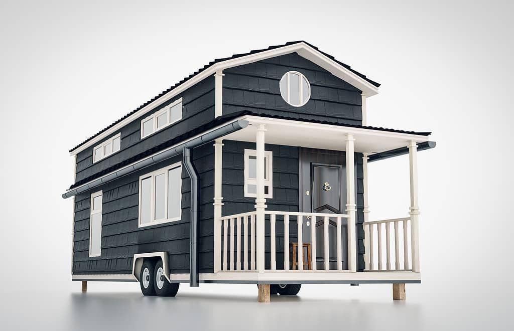 Concetto di una piccola casa scandinava mobile isolata su priorità bassa bianca.  rappresentazione 3D.